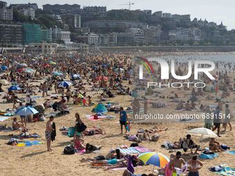 View of La Concha beach in San Sebastian crowded of people, on July 20, 2021. Beachgoers have gathered at the beaches on San Sebastian, Spai...