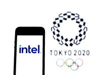 In this photo illustration a Intel Corporation logo seen displayed on a smartphone with a Tokyo 2020 Olympic Games logo in the background. (