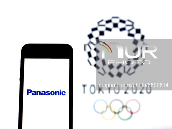 In this photo illustration a Panasonic logo seen displayed on a smartphone with a Tokyo 2020 Olympic Games logo in the background. (