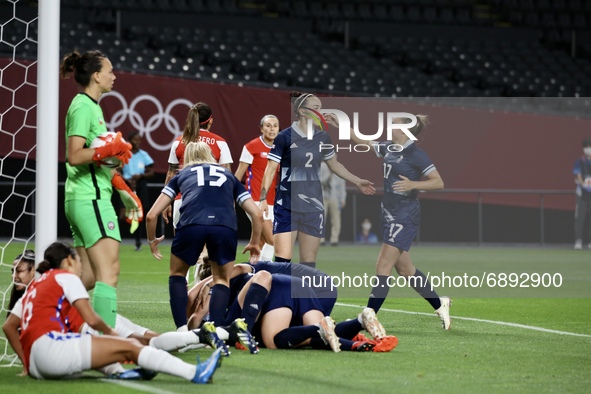 (9) WHITE Ellen of Team Great Britain celebrates with teammates after scoring their first goal during the Women's First Round Group E match...