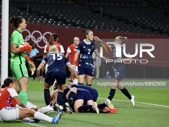 (9) WHITE Ellen of Team Great Britain celebrates with teammates after scoring their first goal during the Women's First Round Group E match...