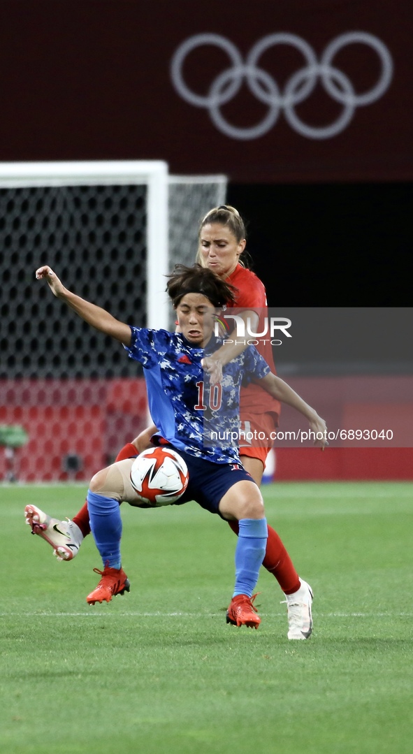 (10)IWABUCHI Mana of Team Japan battles for possession with (4)ZADORSKY Shelina of Team Canada during the Women's First Round Group E match...