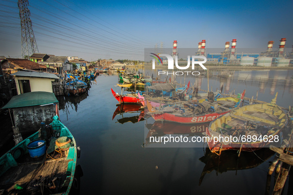 A number of fishing boats rest on a fishing village in Tambaklorok, Semarang, Central Java Province, Indonesia on July 21, 2021. 