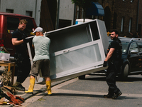 polices are seen moving the furniture with locals  in Erftstadt, Germany on July 22, 2021 as a majoy flooding in Germany (