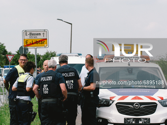 polices are seen in the scene as local people wait to return to their home to collect some personal items in Erftstadt, Germany on July 22,...