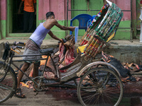 A worker is unloading rawhide in the temporary storage. On July 22, 2021 in Dhaka, Bangladesh. (