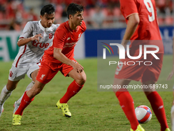 Joao Carlos Teixeira (2-L) of Liverpool is closed down by True Thai Premier League All Stars player during their international friendly matc...
