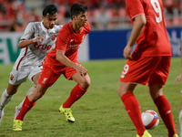Joao Carlos Teixeira (2-L) of Liverpool is closed down by True Thai Premier League All Stars player during their international friendly matc...