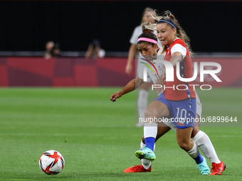 (11) Desiree SCOTT of Team Canada battles for possession with (10) Yanara AEDO of Team Chile during the Women's First Round Group E match be...