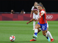 (11) Desiree SCOTT of Team Canada battles for possession with (10) Yanara AEDO of Team Chile during the Women's First Round Group E match be...
