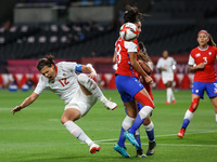 (12) Christine SINCLAIR of Team Canada battles for possession with (14) Daniela ARDO (8) Karen ARAYA of Team Chile during the Women's First...