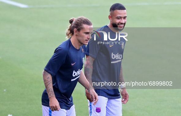 Memphis Depay and Antoine Griezmann during the friendly match between FC Barcelona and Girona FC, played at the Johan Cruyff Stadium on 24th...