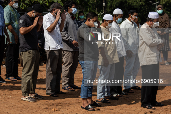 An Imam leads prayers for the bodies of COVID-19 before being buried, in Banten, South Tangerang, Indonesia, on July 26, 2021. 