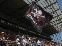 St. Pauli Fan with Flag prior the Second Bundesliga match between FC St. Pauli and Holstein Kiel at Millerntor-Stadium on July 25,  2021 in...