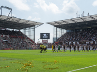 Entry of the teams prior the Second Bundesliga match between FC St. Pauli and Holstein Kiel at Millerntor-Stadium on July 25,  2021 in Hambu...