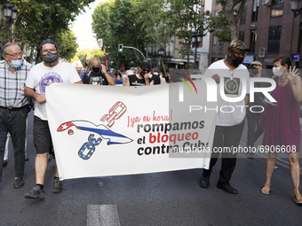 People  at a demonstration against the US economic embargo on Cuba, July 26, 2021, in Madrid, Spain. Coinciding with the day on which the Cu...