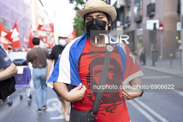 People  at a demonstration against the US economic embargo on Cuba, July 26, 2021, in Madrid, Spain. Coinciding with the day on which the Cu...