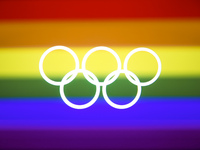 Olympic rings symbol is photographed with LGBT+ rainbow flag in the background in this multiple exposure illustration photo taken in Leszcze...