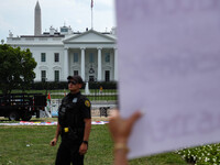 A Secret Service officer blocks an area in front of the White House after they move back thousands of protestors from Lafayette Park during...