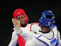 Alfag Issoufou from Nigeria and Seydou Gbane from Ivory Coast during Taekwondo at the Olympics at Makuhari Messe Hall A, Tokyo, Japan on Jul...
