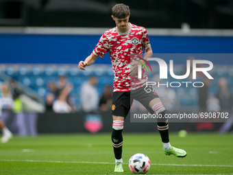   Joe Hugill of Manchester United warms up during the Pre-season Friendly match between Queens Park Rangers and Manchester United at the Kiy...