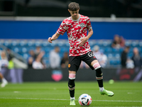   Joe Hugill of Manchester United warms up during the Pre-season Friendly match between Queens Park Rangers and Manchester United at the Kiy...