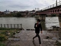 Water Level increased in River Jehlum after rainfall started in Sopore, District Baramulla Jammu And Kashmir, India on 28 July 2021. 4 dead,...