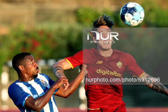 Wilson Manafa of FC Porto (L) vies with Nicolo Zaniolo of AS Roma during an international club friendly football match between AS Roma and F...