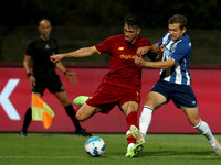 Roger Ibanez of AS Roma (L) vies with Francisco Conceicao of FC Porto during an international club friendly football match between AS Roma a...