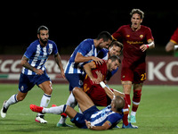Pepe of FC Porto (center down) argues with Henrikh Mkhitaryan of AS Roma (C ) during an international club friendly football match between A...