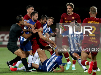 Pepe of FC Porto (center down) argues with Henrikh Mkhitaryan of AS Roma (4th L) during an international club friendly football match betwee...