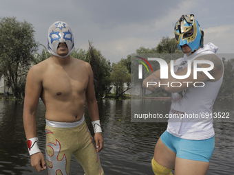 Gran Felipe Jr. (left) and Warrior Jr. (right), professional wrestlers, pose before a wrestling event where they went head to head with othe...