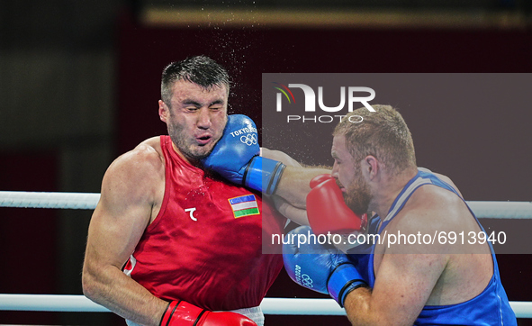 Bakhodir Jalolov from Uzbekistan and Mahammad Abdullayev from Azerbijdan during pre final boxing knock out rounds at Kokugikan arena at the...