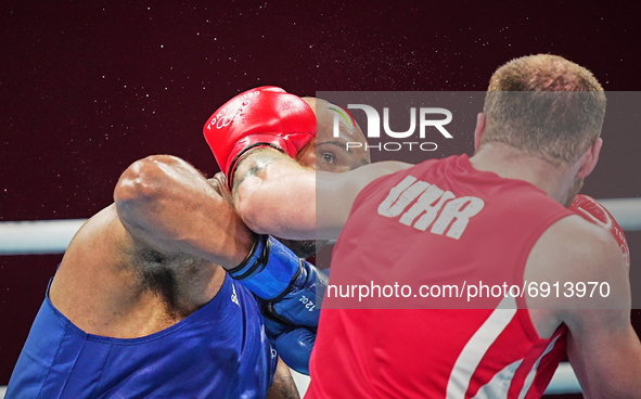 Frazer Clarke from Great Britain and Tsotne Rogava from Ukraine during pre final boxing knock out rounds at Kokugikan arena at the Tokyo Oly...