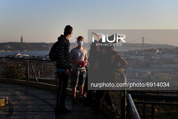 Tourists visit the Nossa Senhora de Monte viewpoint in Lisbon. 28 July 2020. The General Health Authority's Bulletin records 13 deaths and 3...