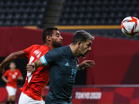 (14) Ahmed RAYAN of Team Egypt is challenged by (14) Facundo MEDINA of Team Argentina during the Men's First Round Group C match between Egy...