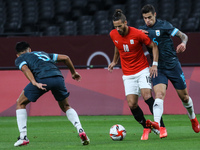 (10) Ramadan SOBHI of Team Egypt is challenged by (5) Fausto VERA & (6) Leonel MOSEVICH of Team Argentina during the Men's First Round Group...