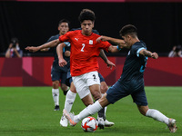 (2) Ammar HAMDY of Team Egypt is challenged by (3) Claudio Bravo of Team Argentina during the Men's First Round Group C match between Egypt...