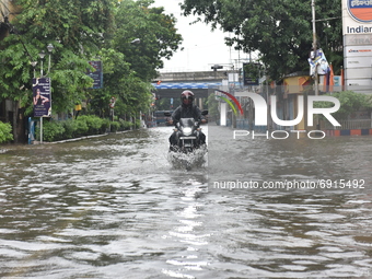A motorcyclist is seen waded through a waterlogged street in Kolkata, India, on July 30, 2021. (