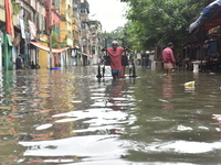 A hand pulled rickshaw is seen waded through a waterlogged street in Kolkata, India, on July 30, 2021. (