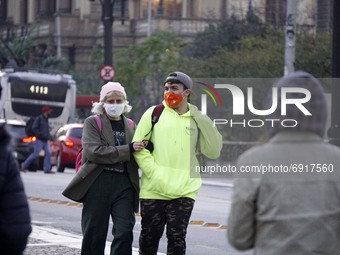 People walk in Sao Paulo, Brazil, on July 31, 2021 during a cold day. (