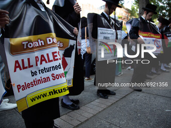 Orthodox jewish people stand demonstrate in support of Palestine in Brooklyn, New York, US, on July 31, 2021.  (