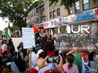 People hold sing during a demonstrate in support of Palestine in Brooklyn, New York, US, on July 31, 2021.  (