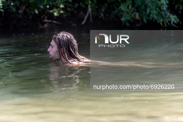Environmental  activist take a bath in a river in Turnicki forest on July 28, 2021 near Arlamow, Carpathian mountains, south-eastern Poland....