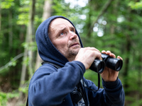 Environmental  activists walk in Turnicki forest  in search of rare animal species and plants on July 28, 2021 near Arlamow, Carpathian moun...