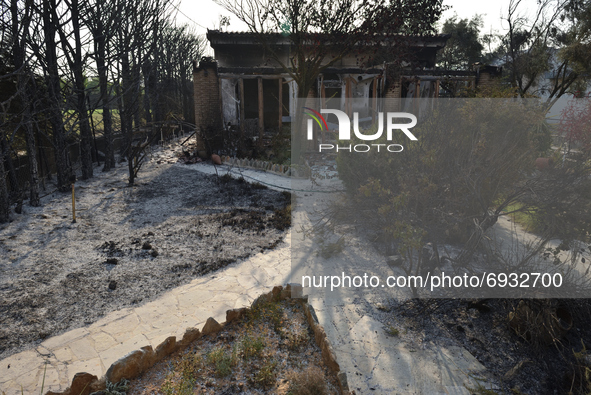 A building is destroyed by the wildfire in the northern suburb of Athens Varimpompi, on August 4, 2021. 