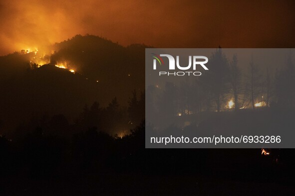 Night Images of  the wildfire burring pine forest and olive groves on the hills of Evia in Greece, on August 4, 2021. The area of the fires...