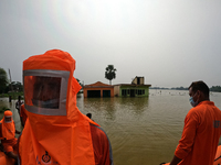 National Disaster Response Force (NDRF) personnel rescue operations in the flood hit city of Amta-2 in the Howrah district about 82 kms from...