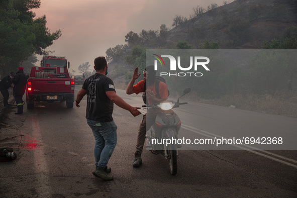 Villagers and volunteers did everything the could to fight off the flames, during the wildfires in Evia, the second largest island of Greece...