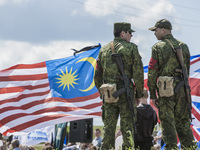 DNR soldiers watche close to a malaysian flag during the celebrations of the anniversary of the tragedy of the malaysian flight MH17 shot do...